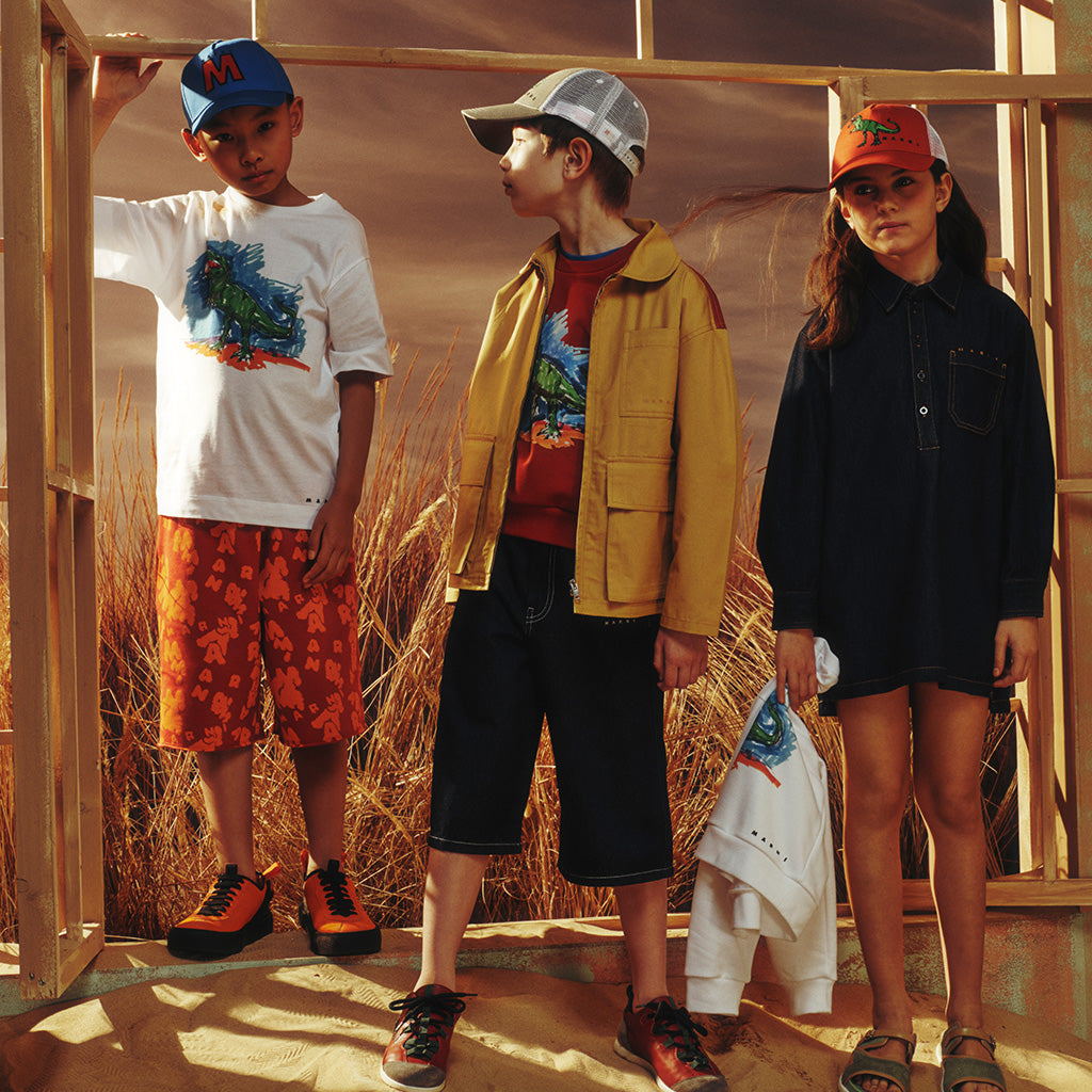 A group of boys standing with cool looks