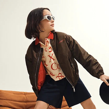 Jackets category - A girl wearing a cool outfit with a stylish jacket, sunglasses and a bag