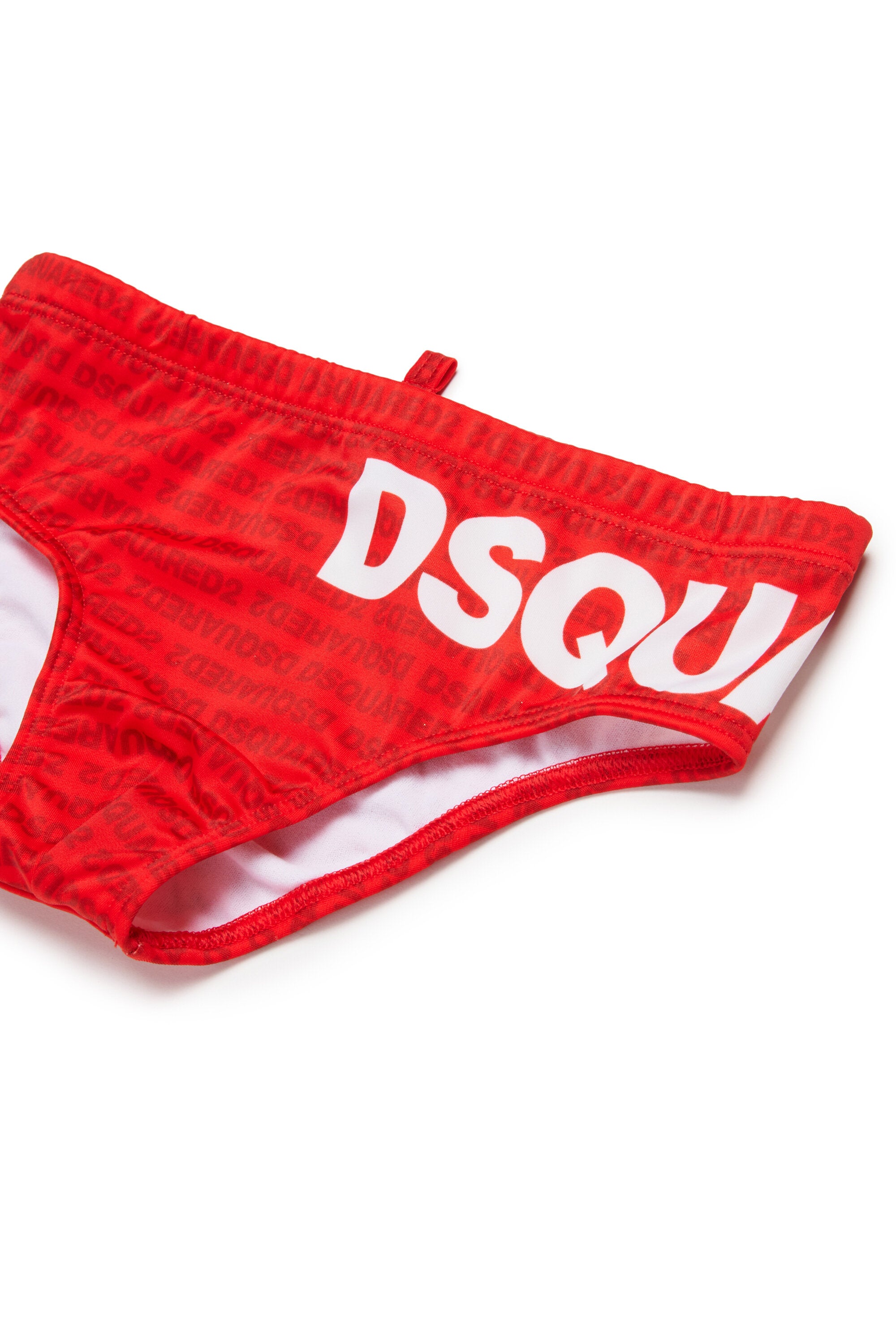 Bañador slip con logo por todas partes