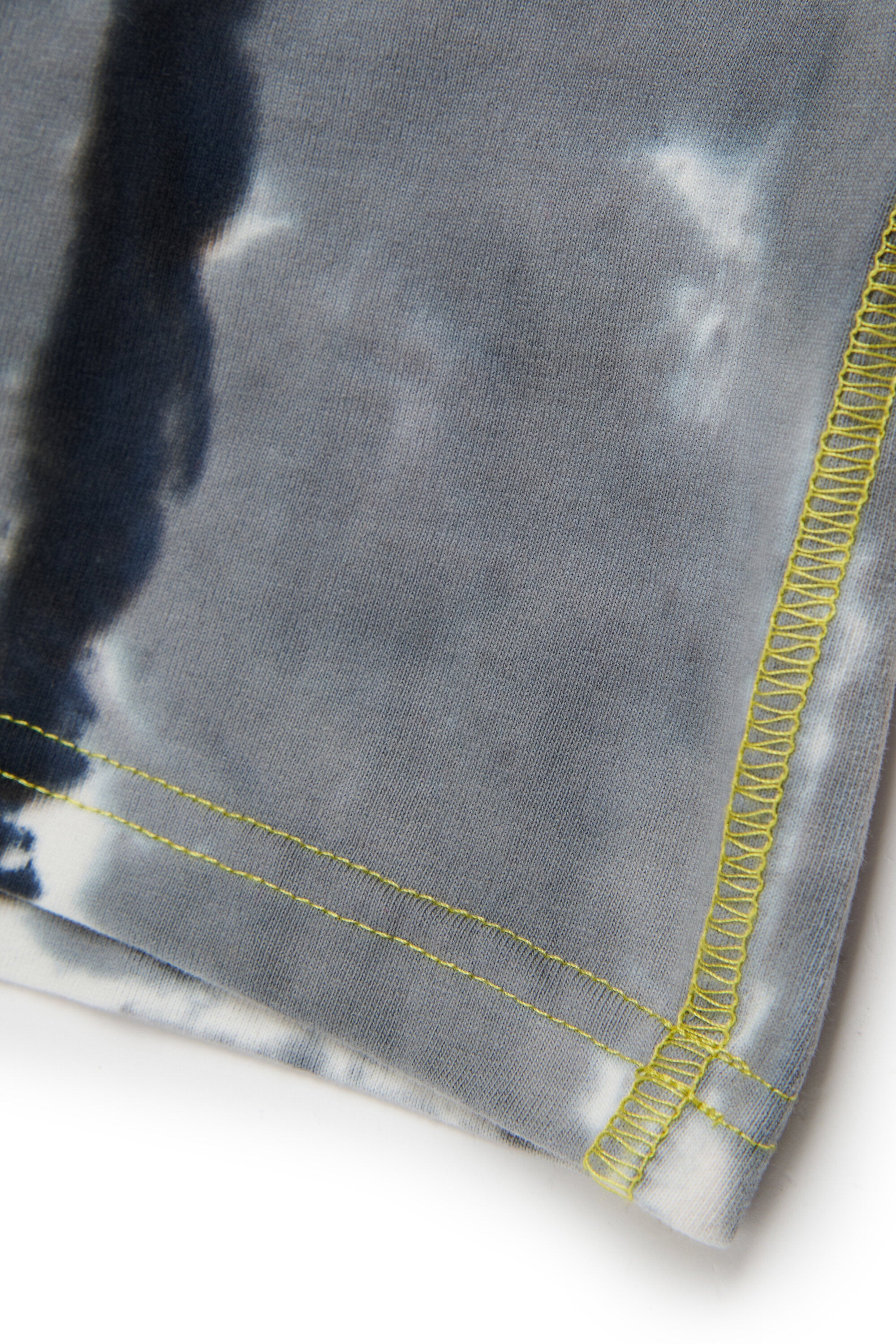 Batik T-shirt branded with Oval D logo