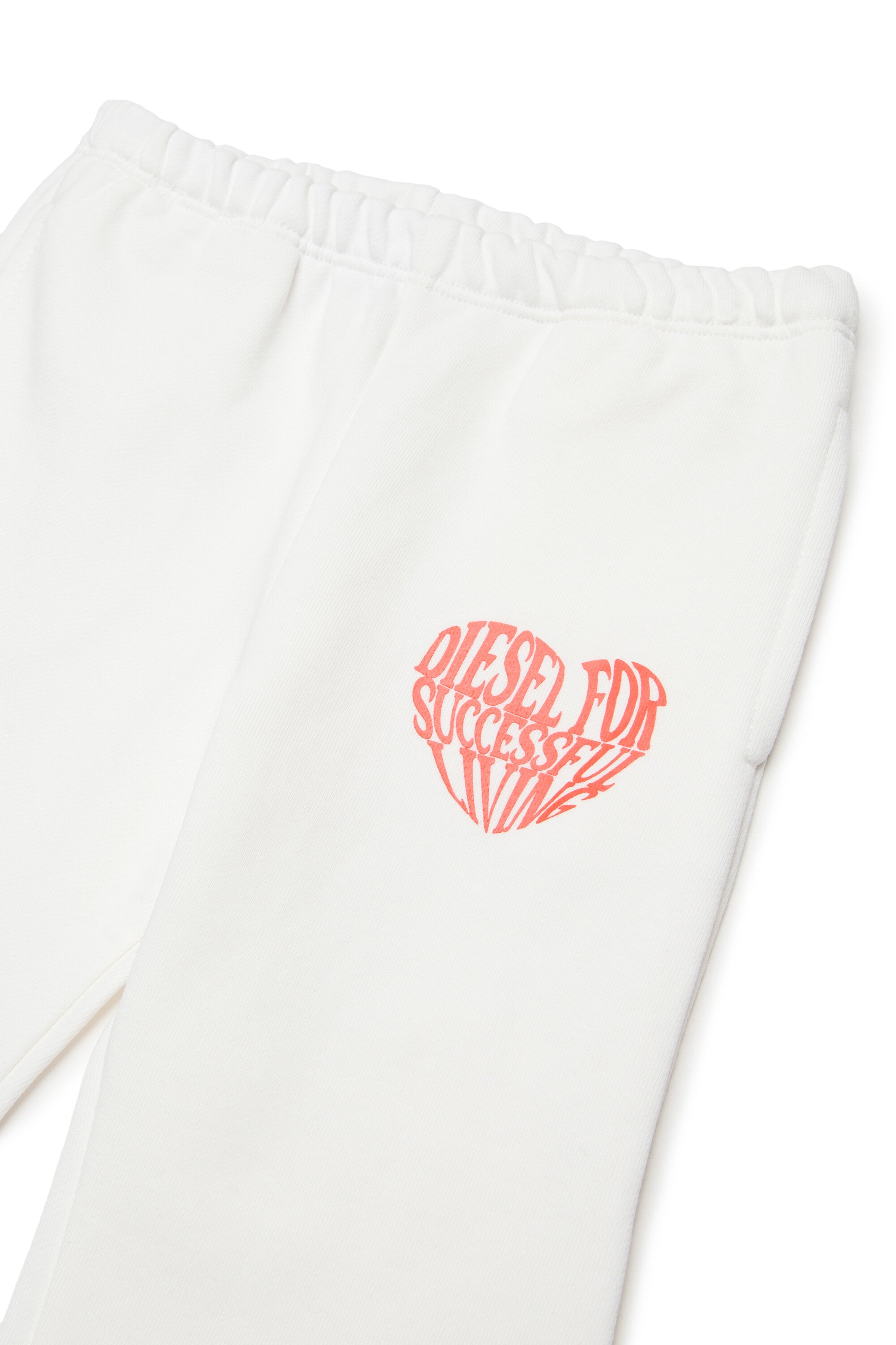 Pantalones de felpa con logo de corazón