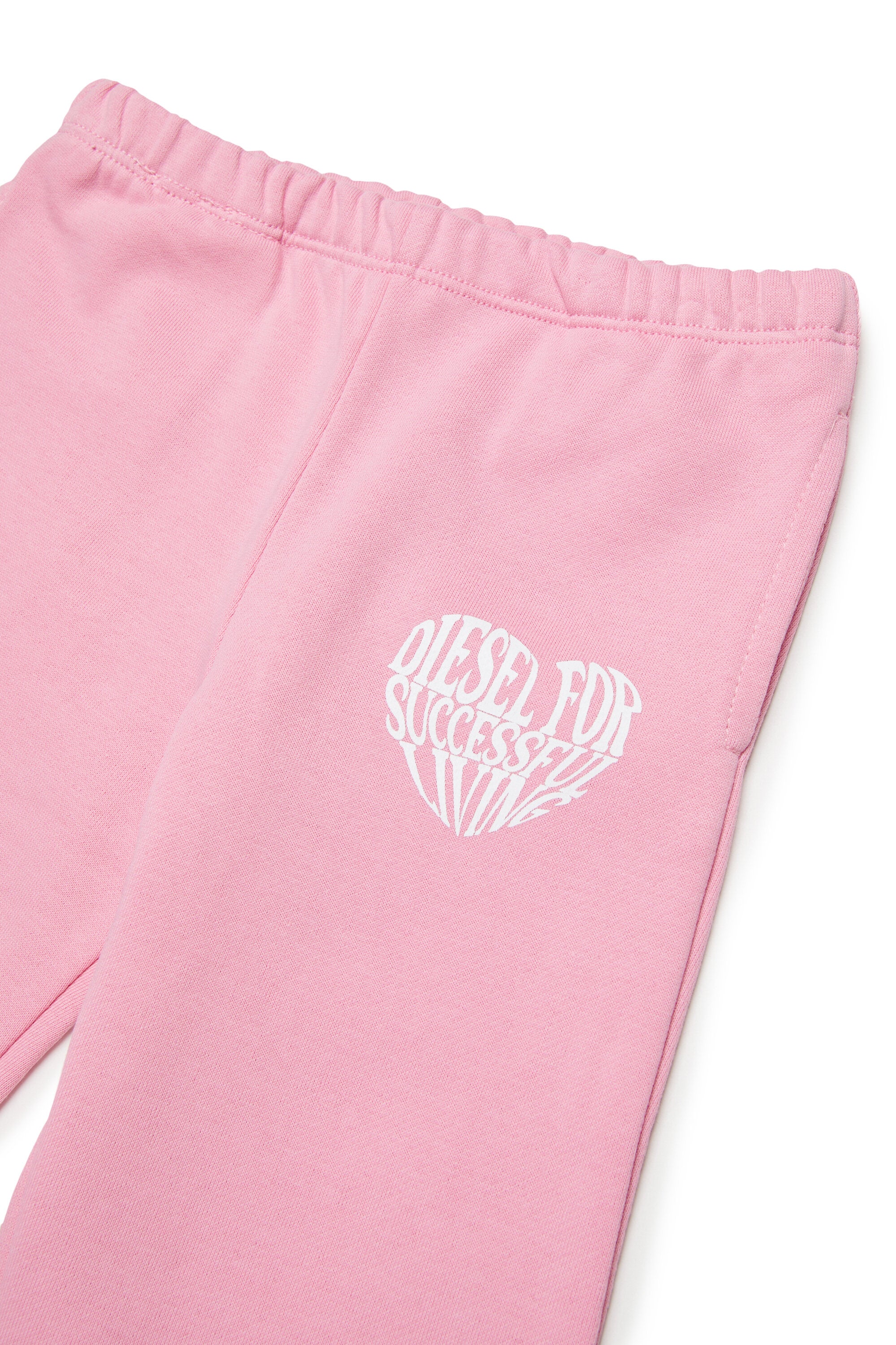 Pantalones de felpa con logo de corazón