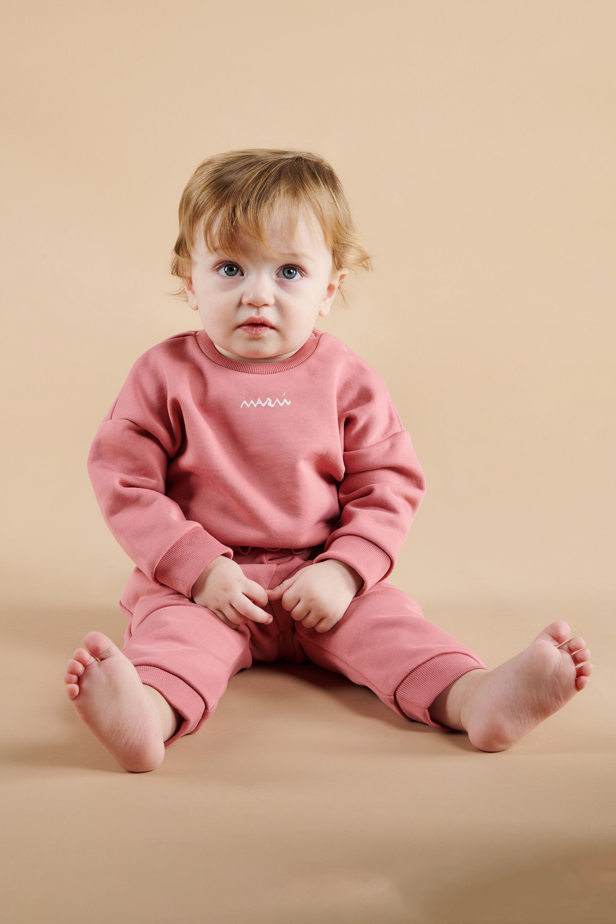 Sudadera de cuello redondo con volantes en el bajo