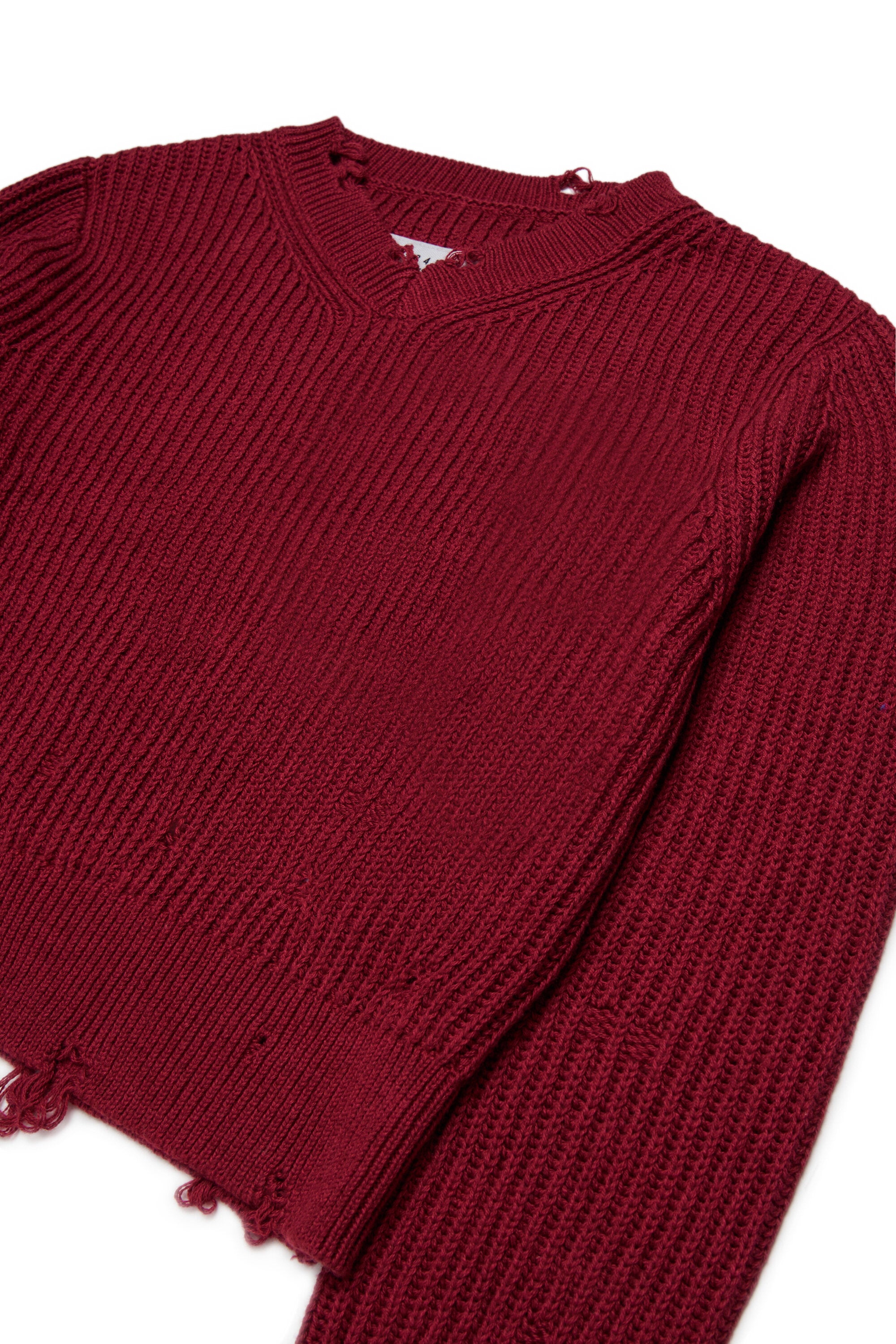 Jersey de cuello en V con detalles desgastados