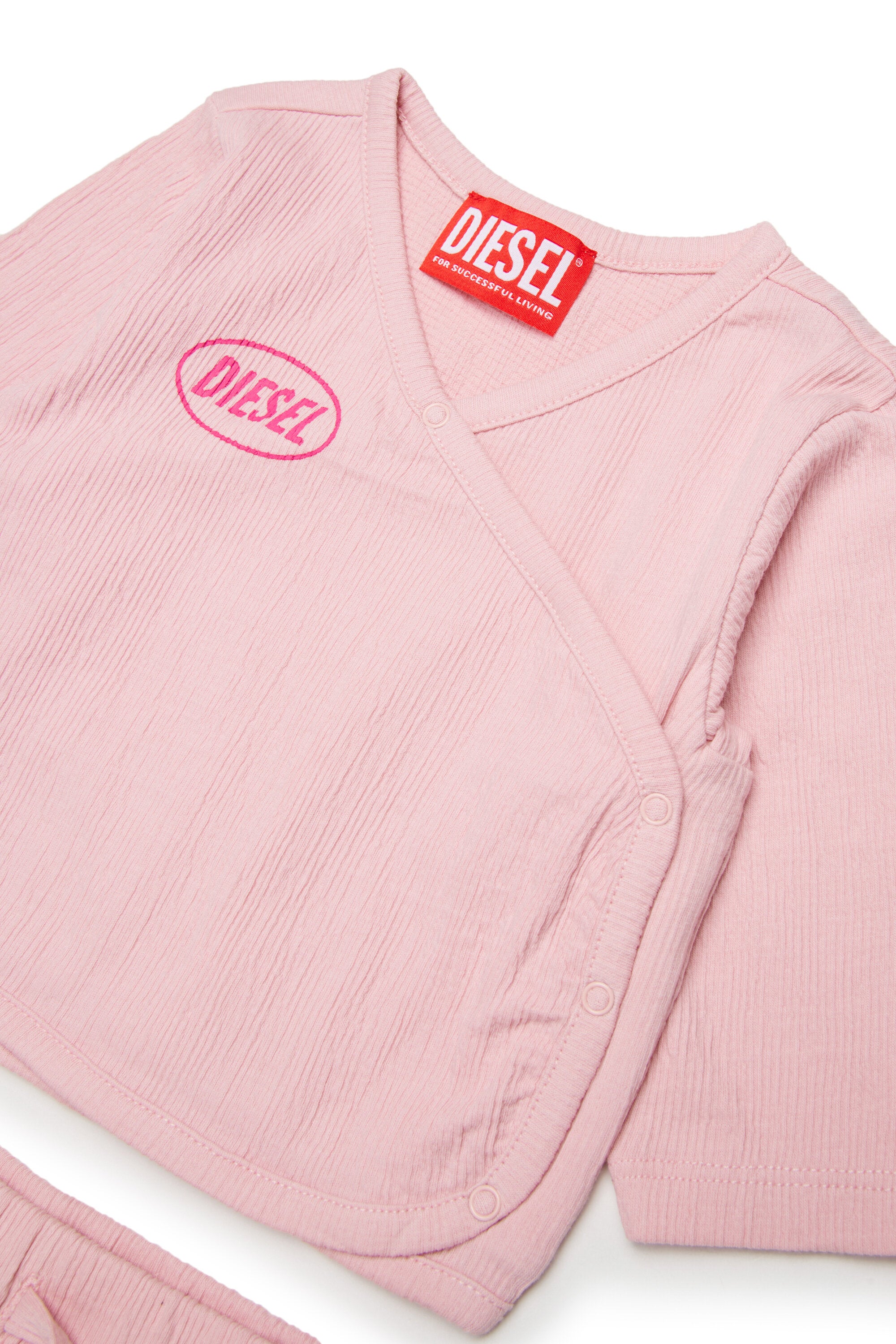 Baby jumpsuit with logo