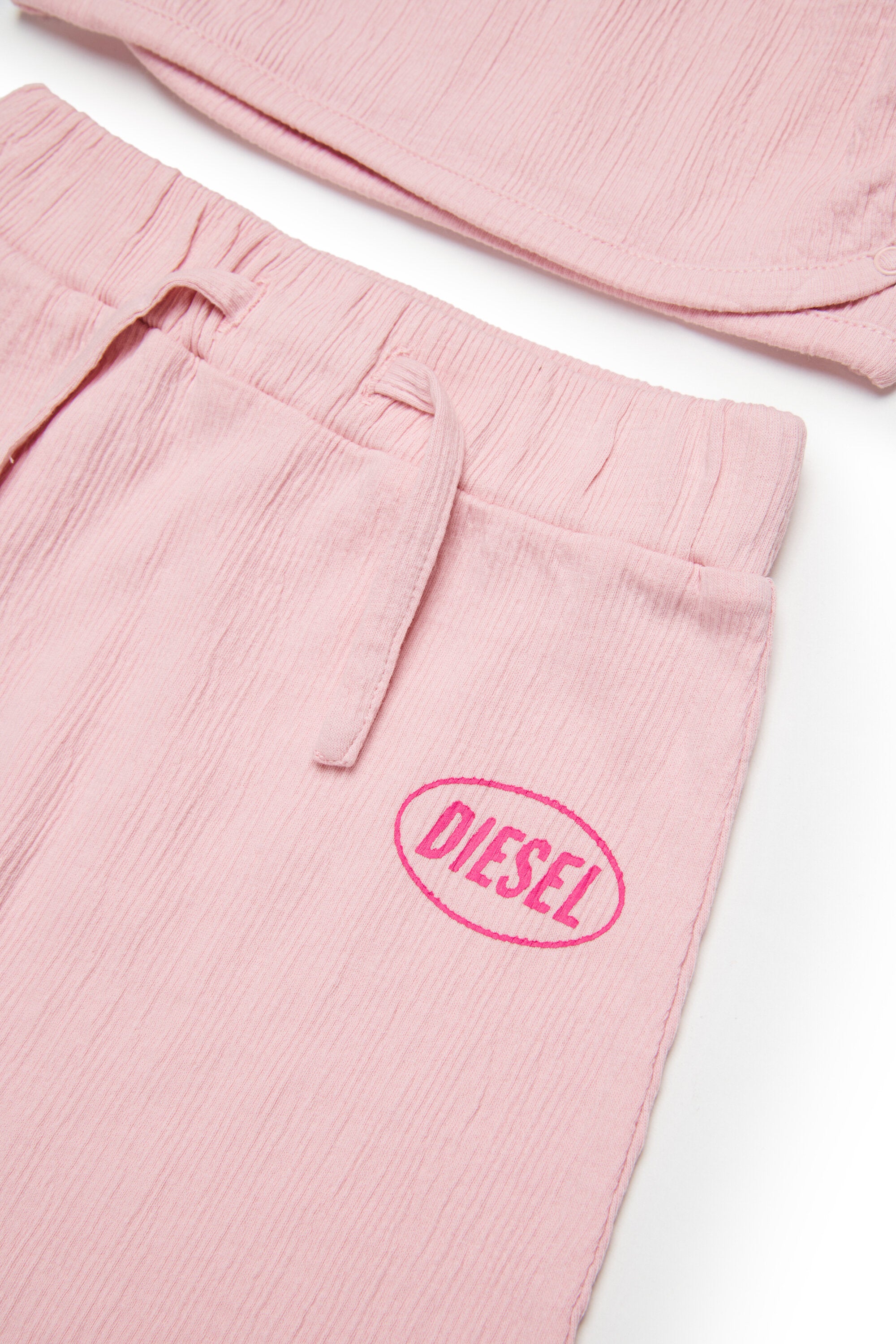 Baby jumpsuit with logo