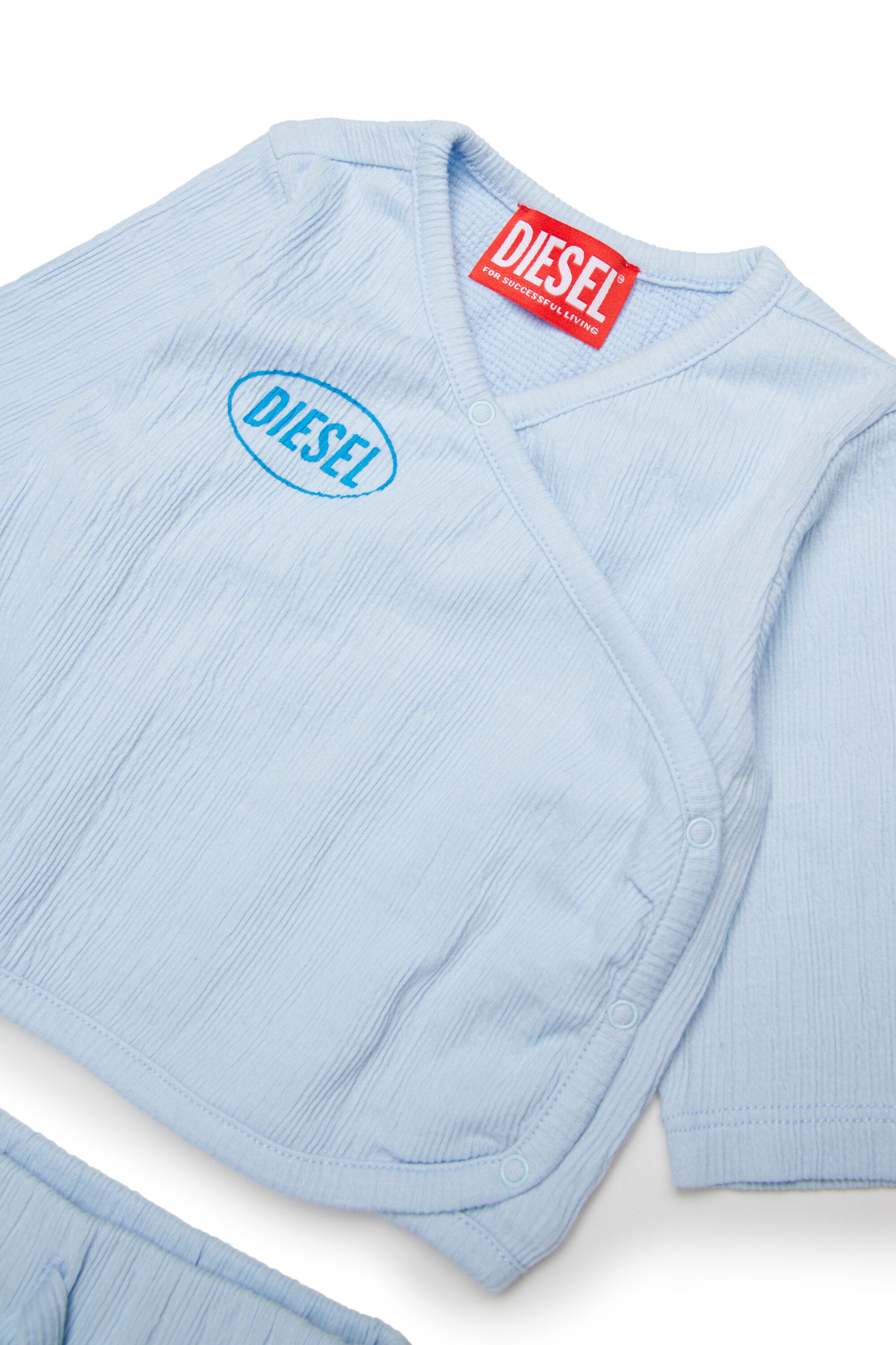 Baby jumpsuit with logo