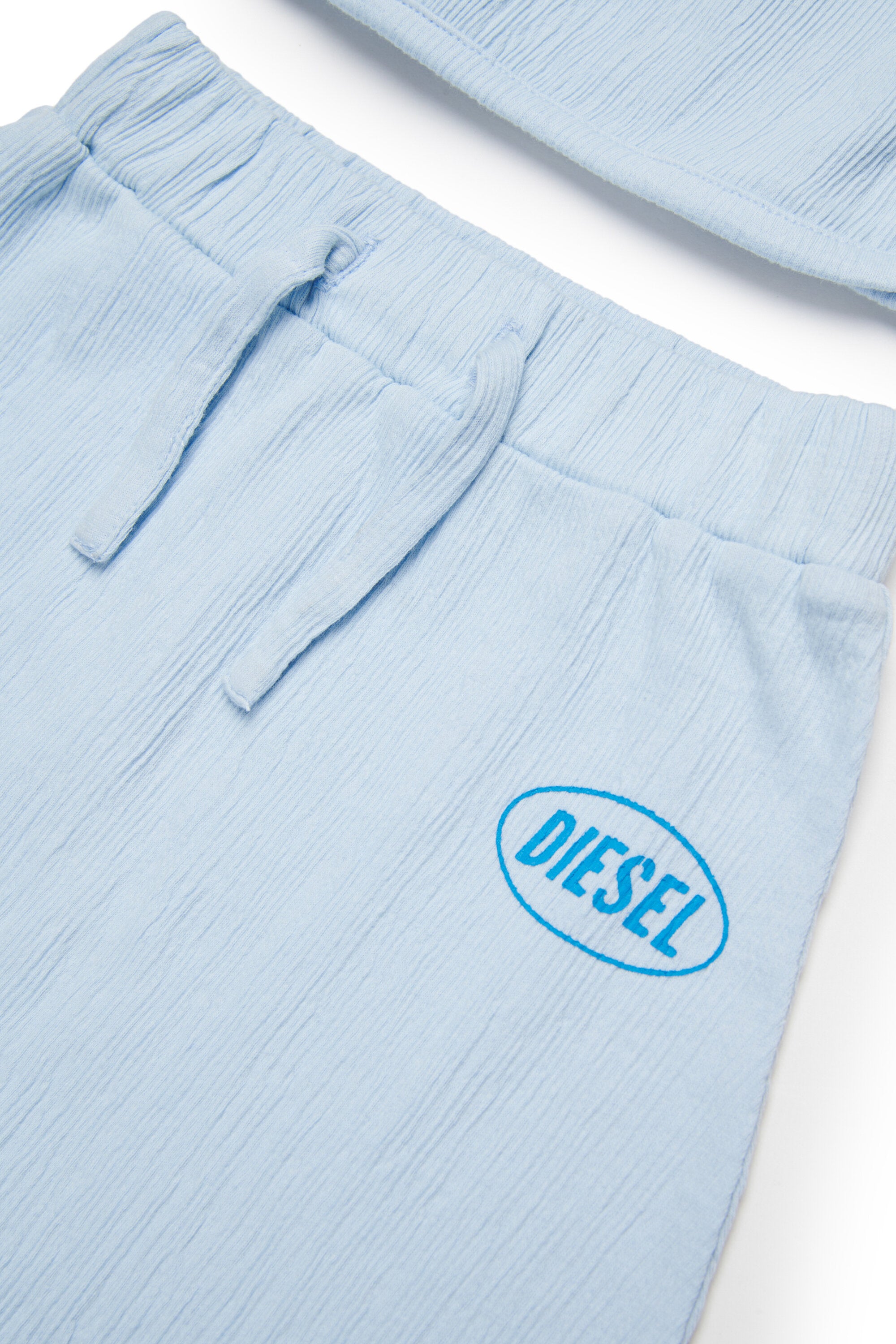 Baby jumpsuit with logo