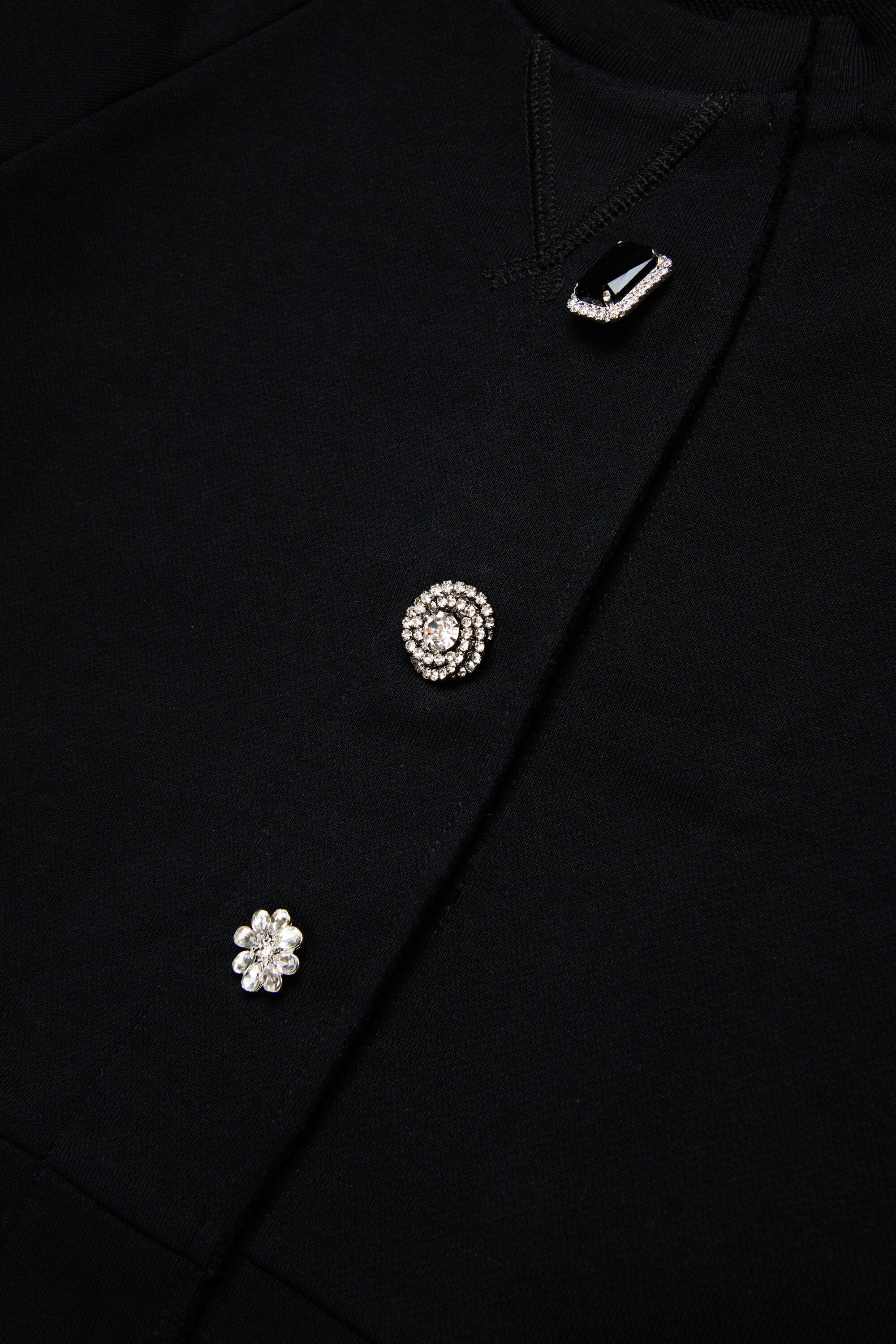 Sudadera tipo cárdigan con botones joya