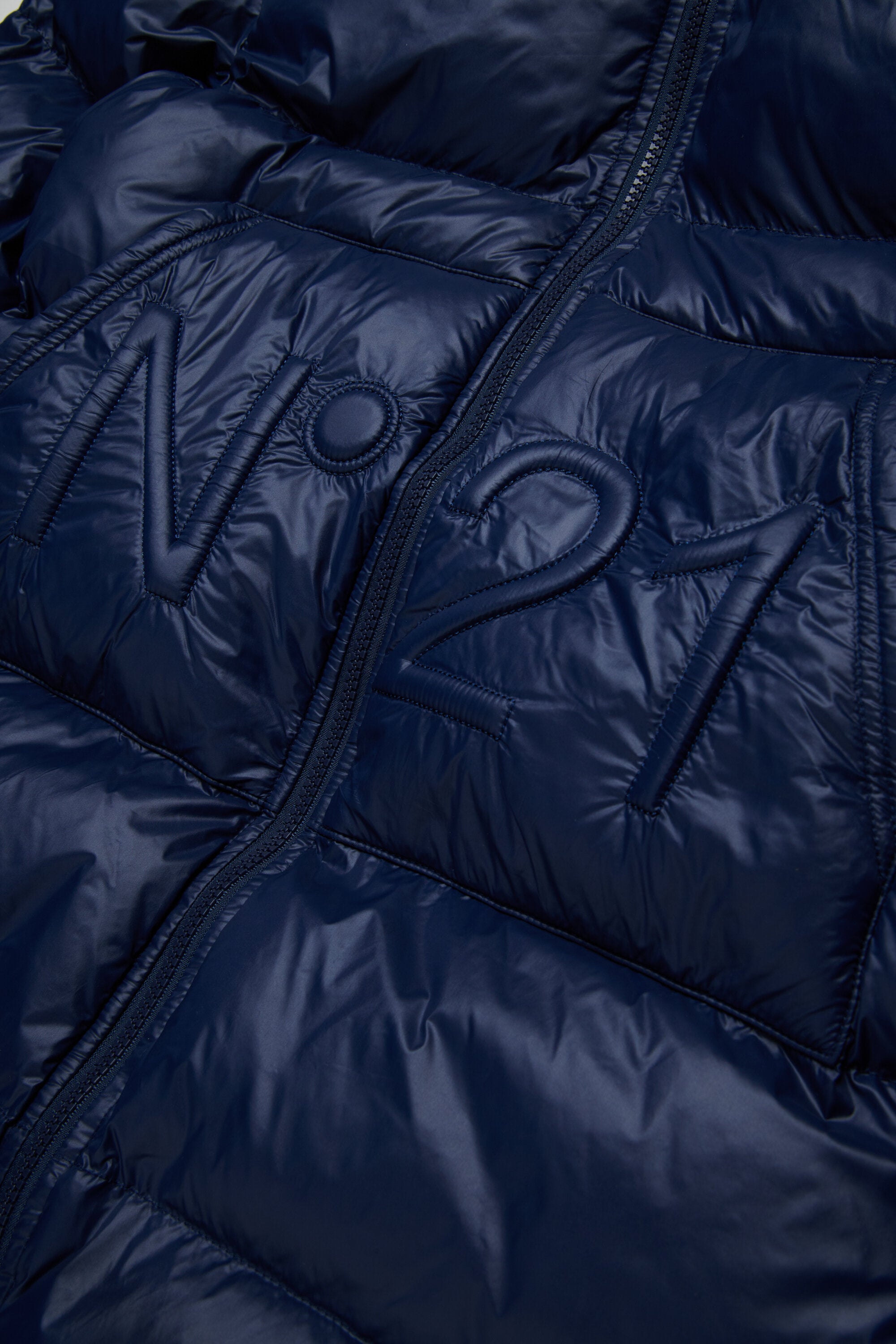 Chaqueta larga acolchada con dobladillo asimétrico