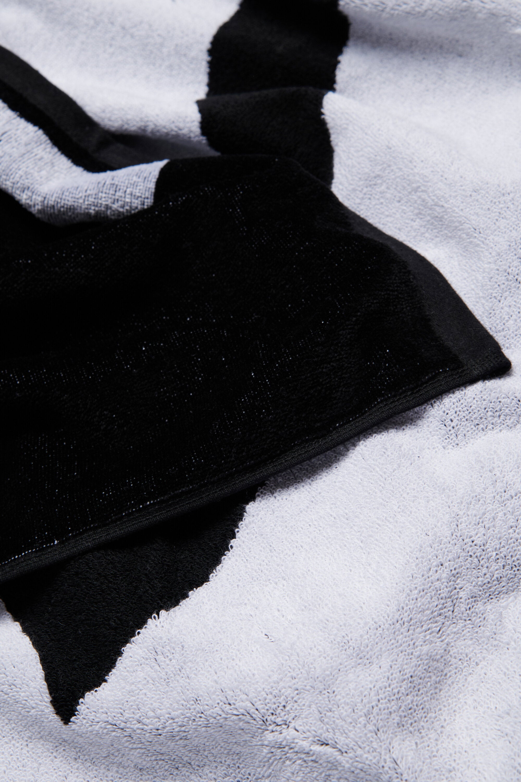 Black terry beach towel with maxi-logo