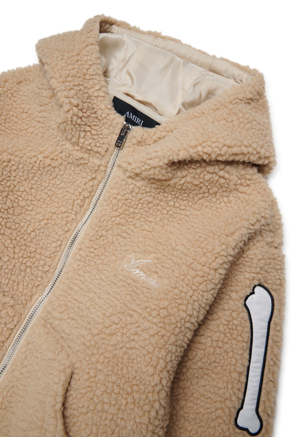 Chaqueta teddy con detalles de huesos