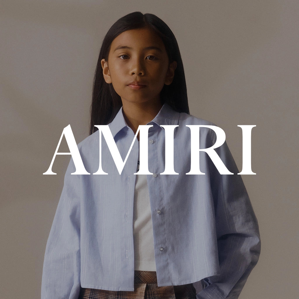 A girl wearing a stylish outfit, with the 'Amiri' brand name displayed over the image.