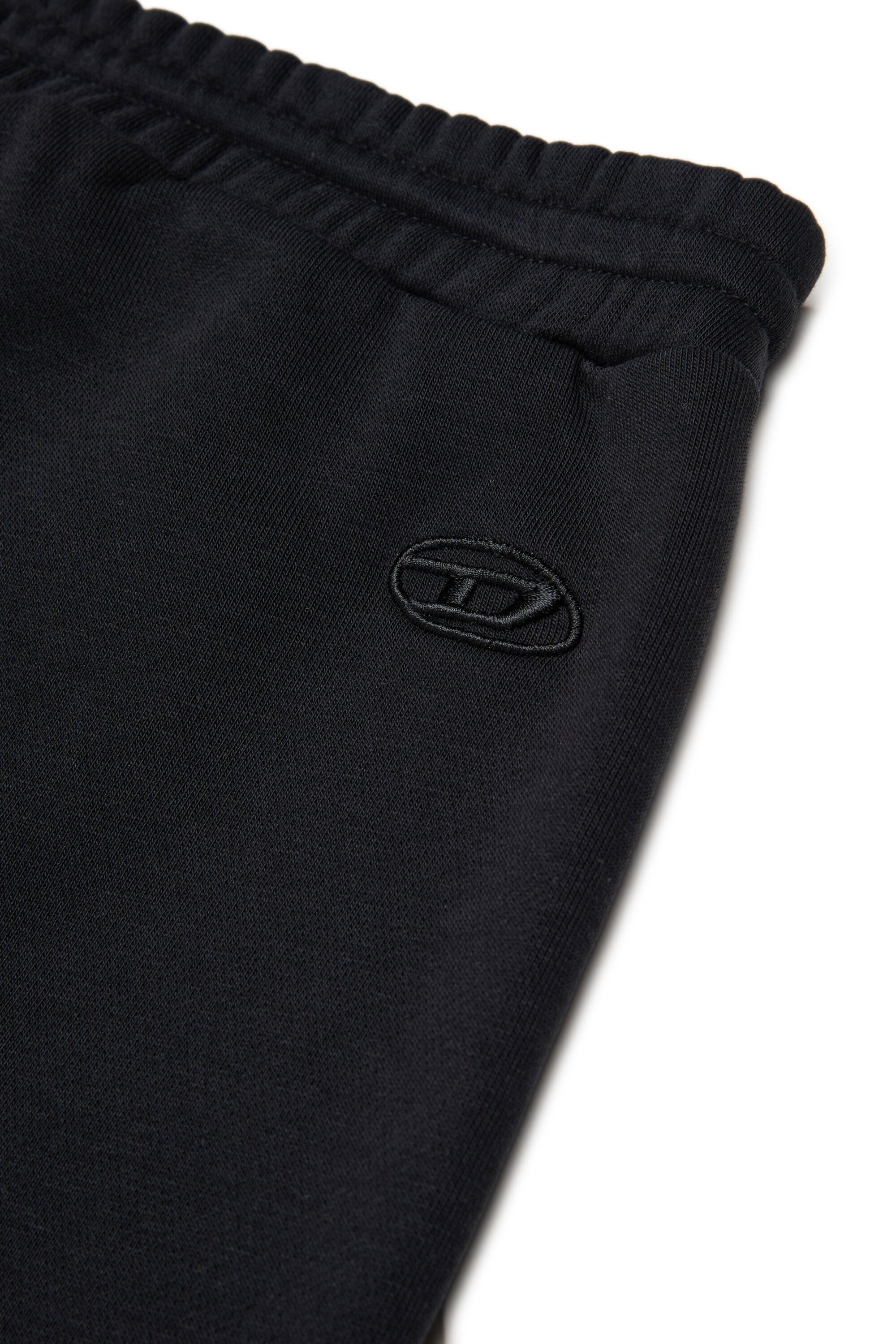 Pantalones deportivos con falsa solapa