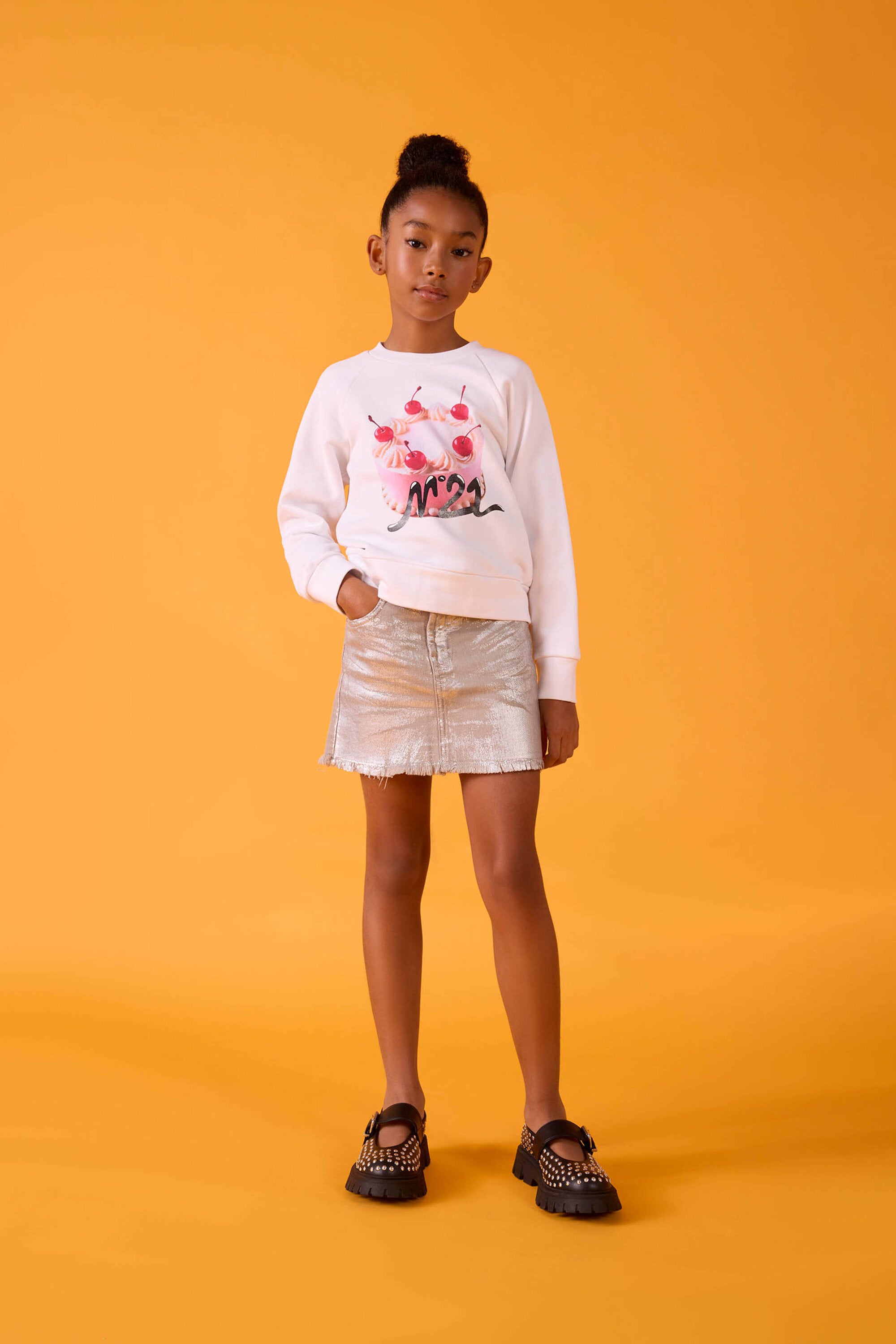 Laminated mini skirt with a fringed effect