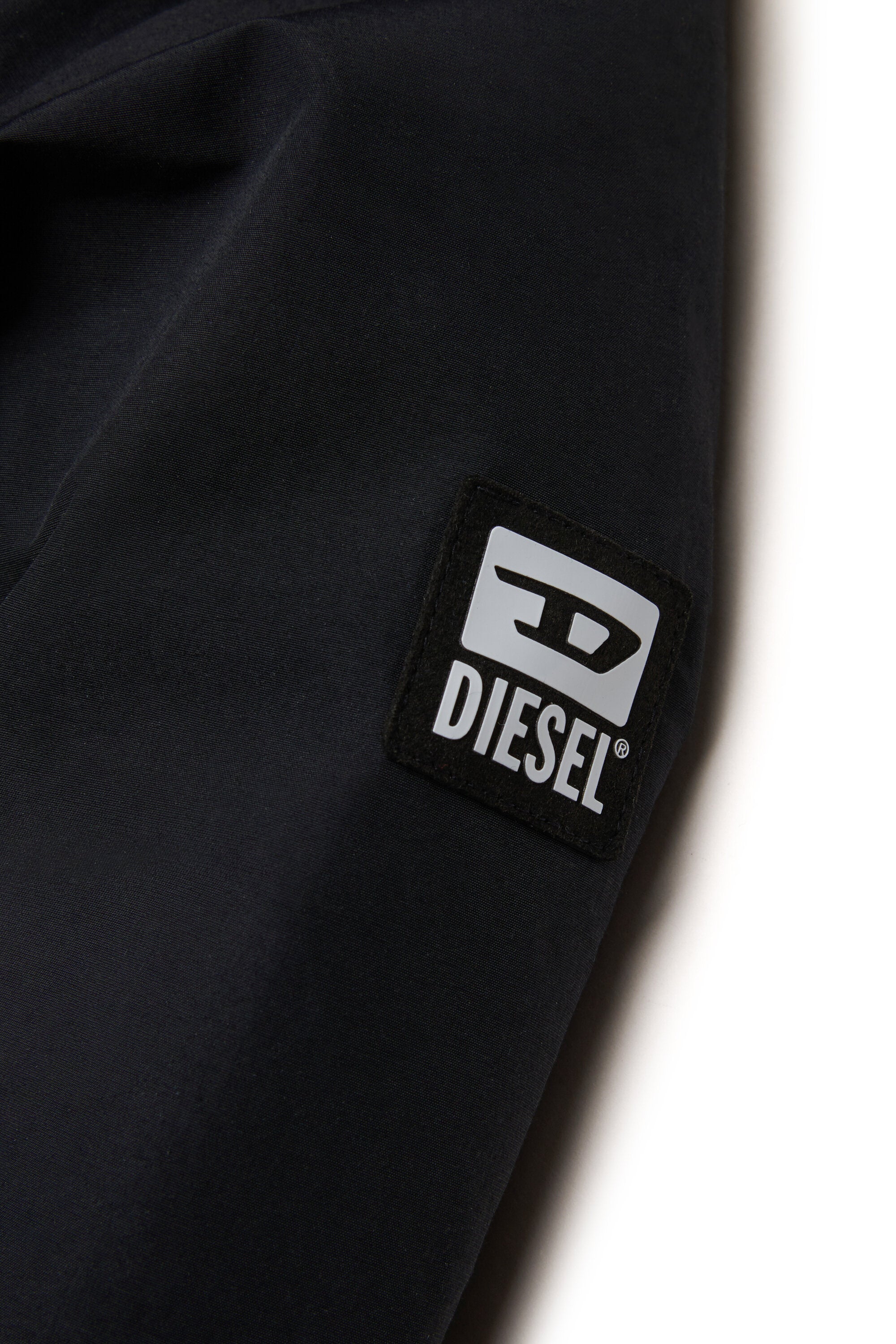 Chaqueta acolchada con capucha de piel sintética y bolsillos