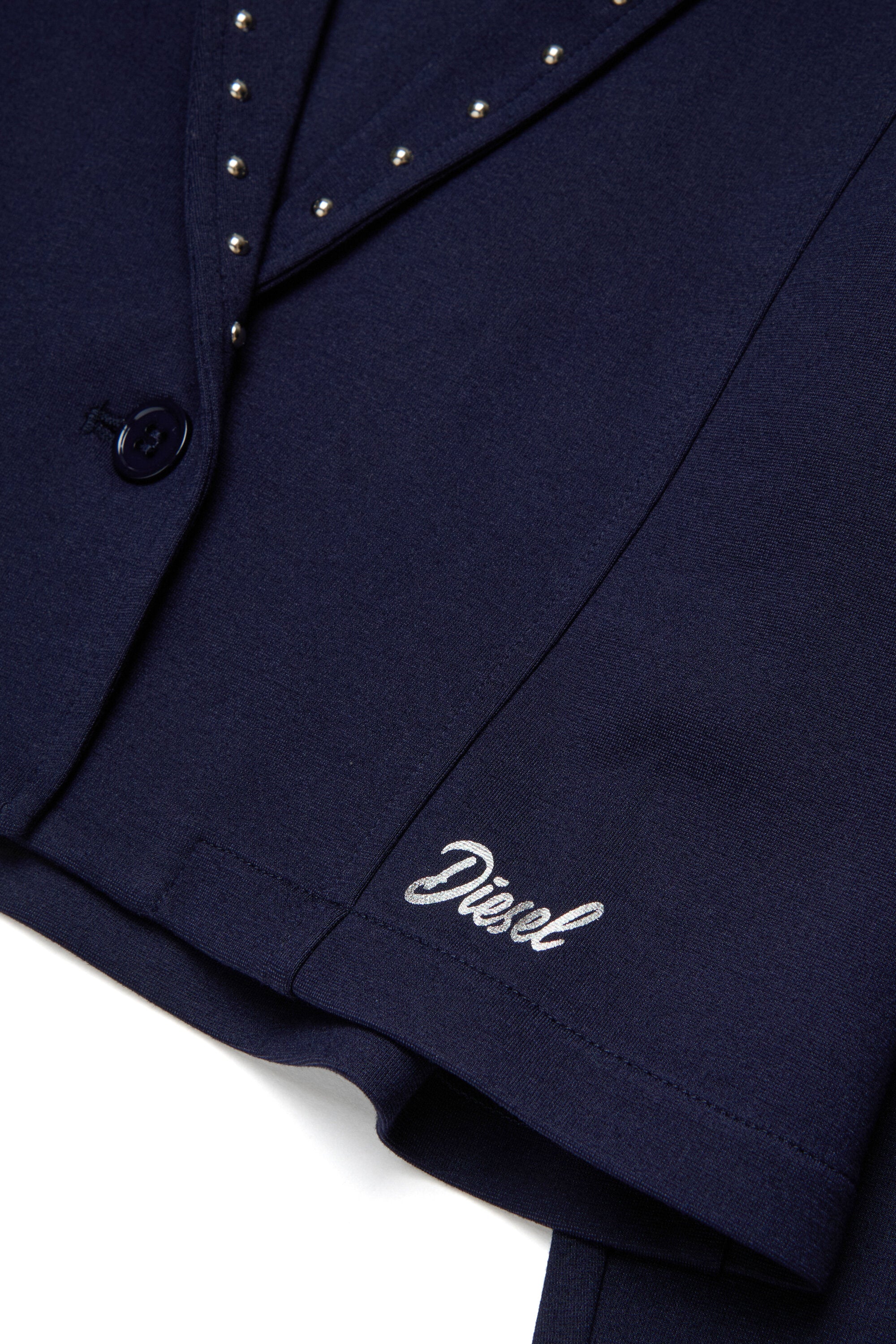 Blazer con tachuelas y logo