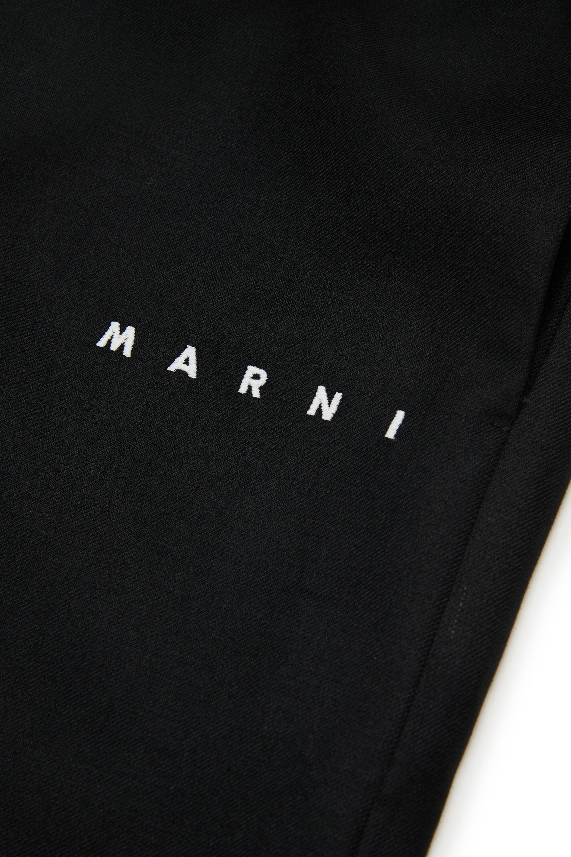 Pantalones anchos de franela con logotipo