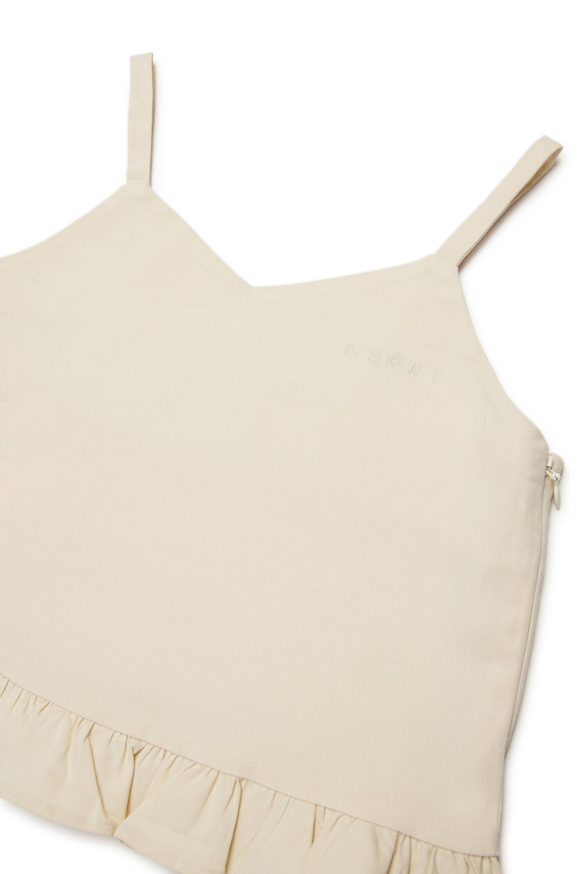 Top sin mangas con volantes y logo