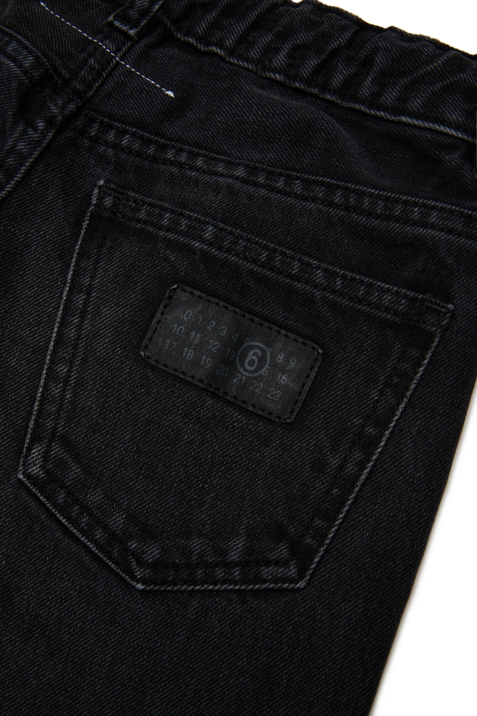 Jeans corte acampanado efecto usado