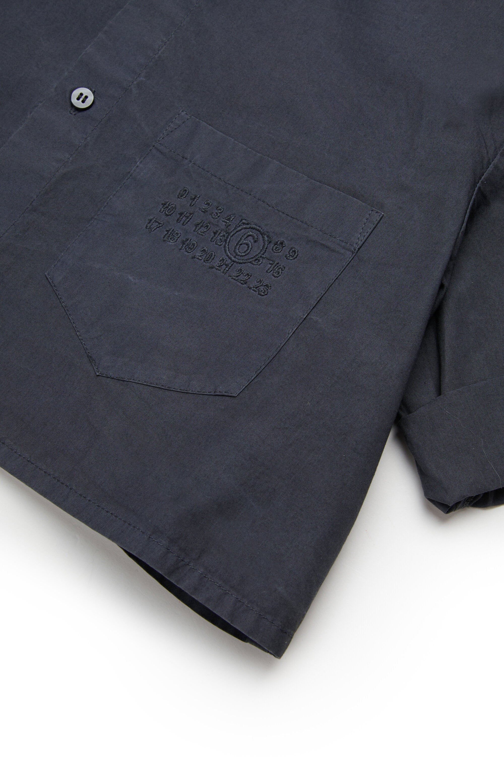 Camisa de popelín con mangas vueltas