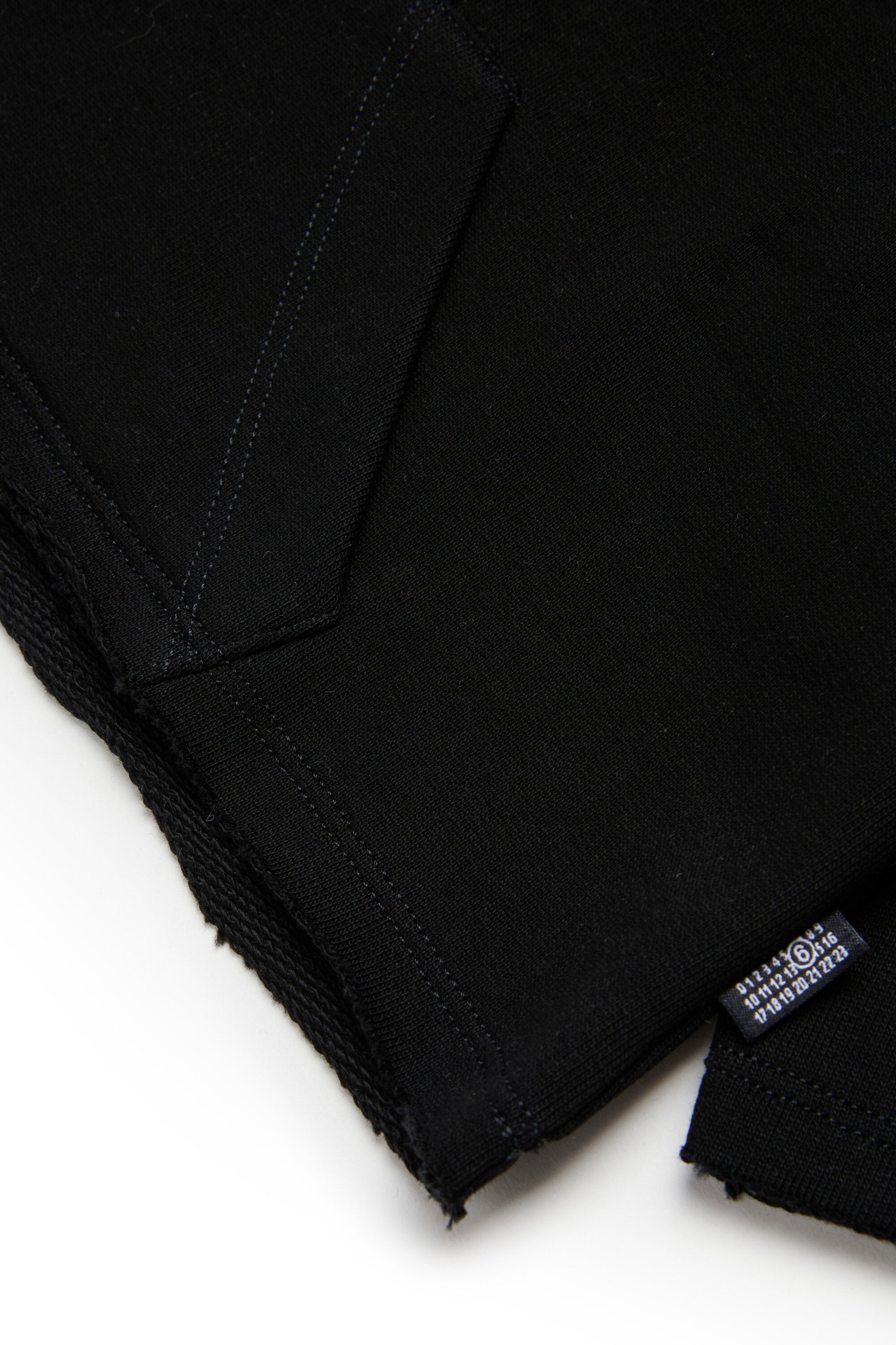 Sudadera con capucha y dobladillo con corte en crudo