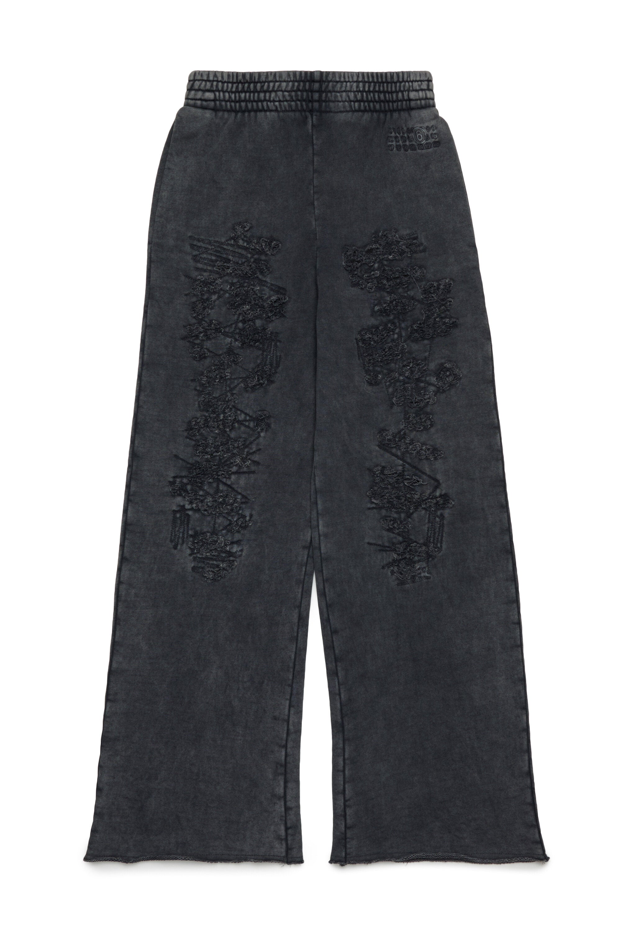 Pantalones sudadera con roturas zurcidas