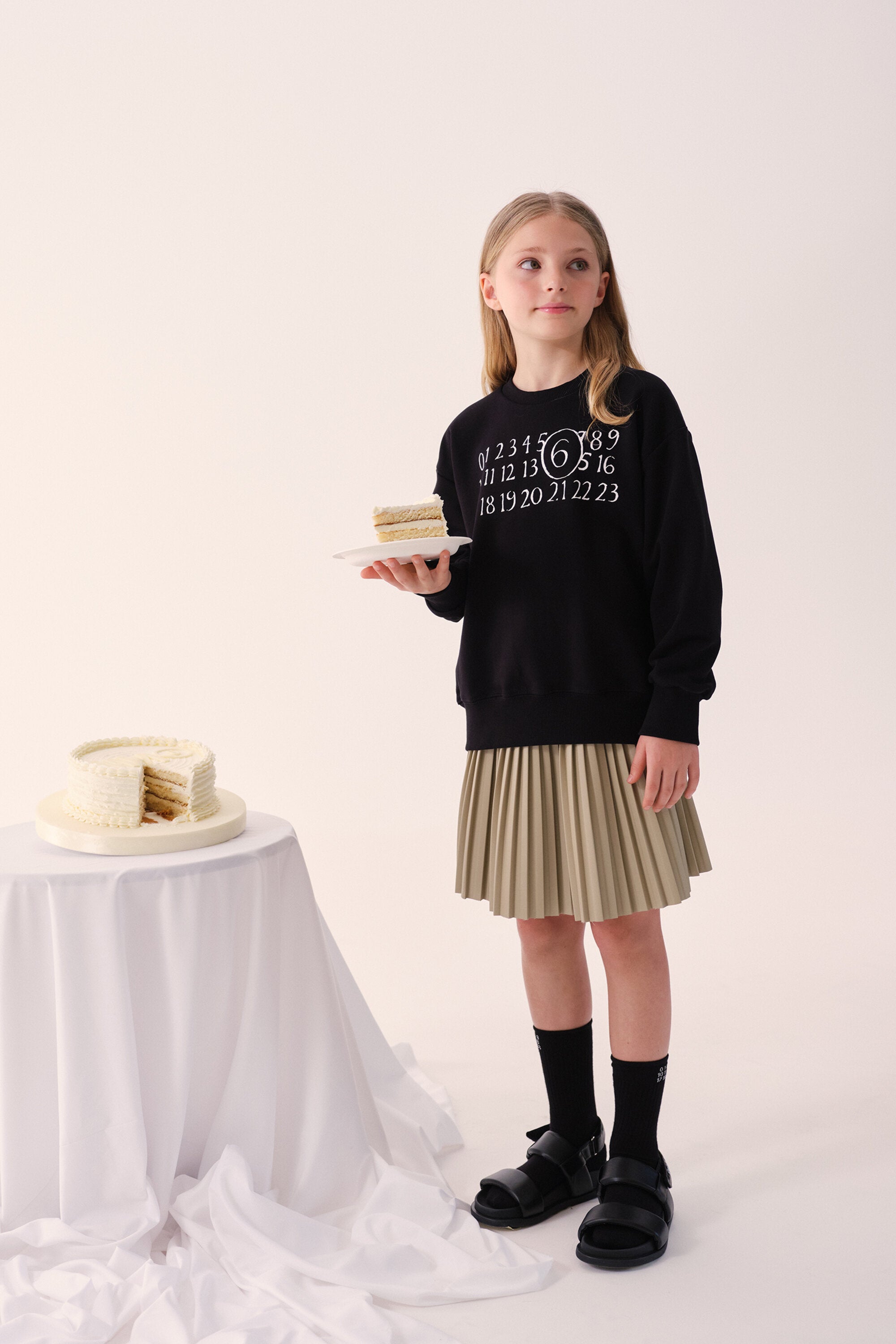 Falda plisada con logo