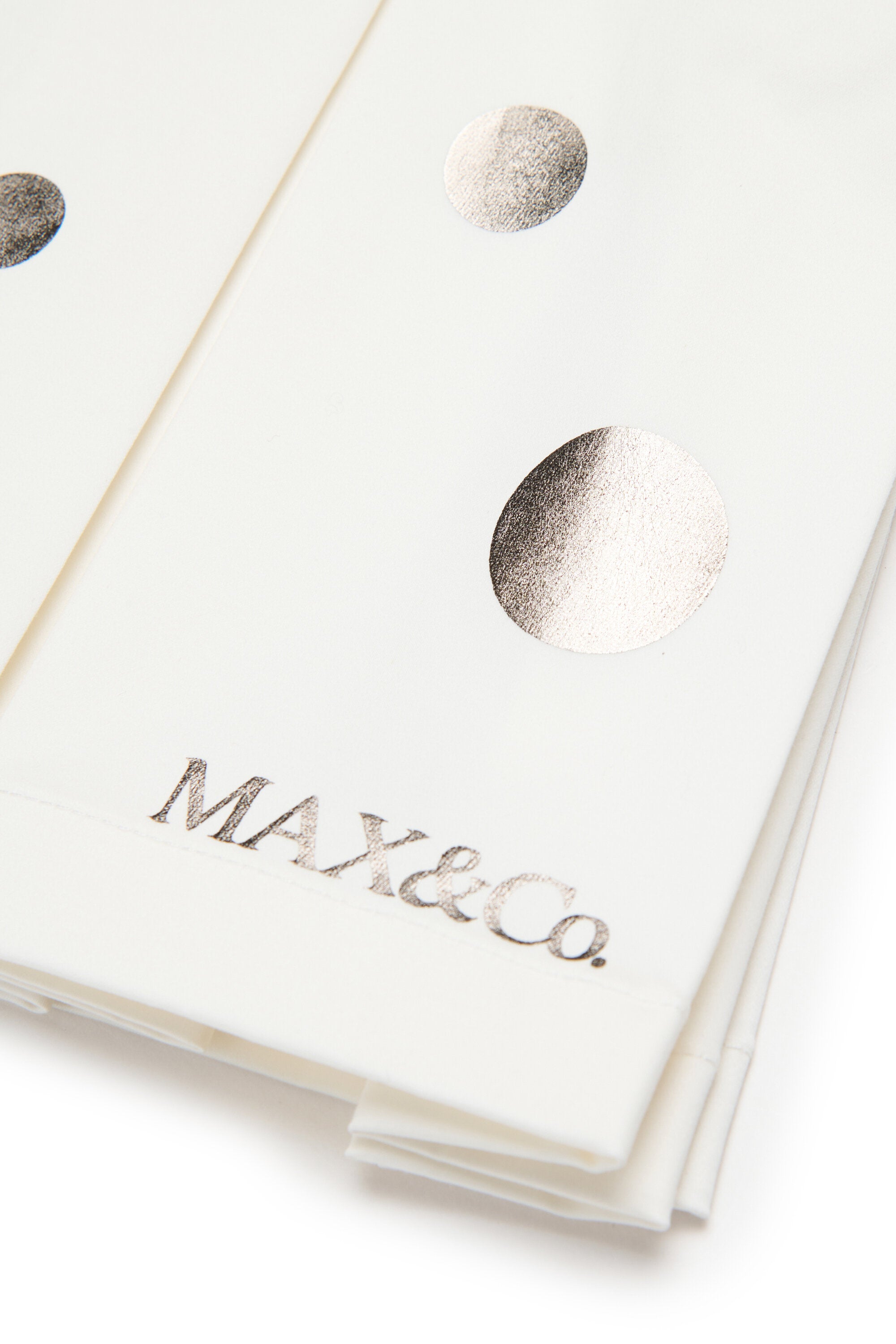 Falda plisada con lunares metálicos